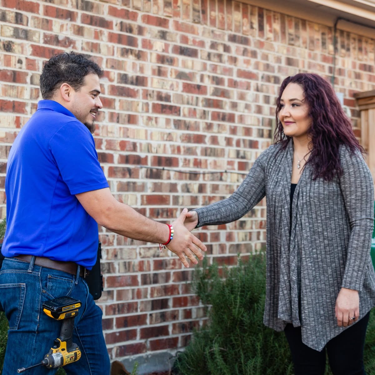 Mario shaking hands with a customer after the job