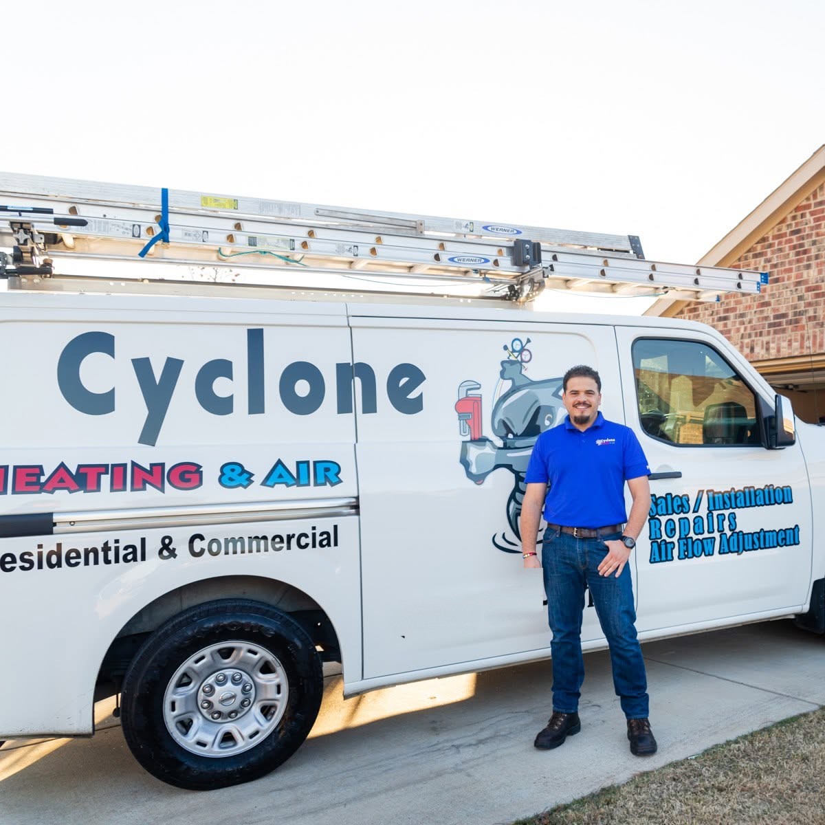 Mario, owner of Cyclone Heating & Air, beside the company service van