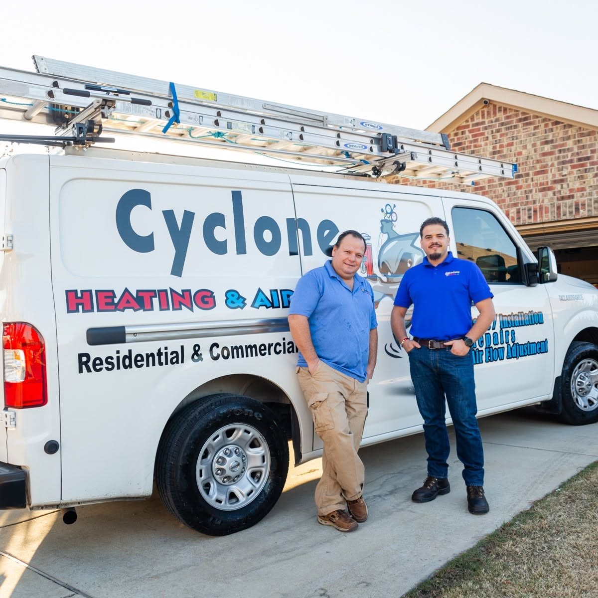 Cyclone Heating & Air technicians at the service van in Forney